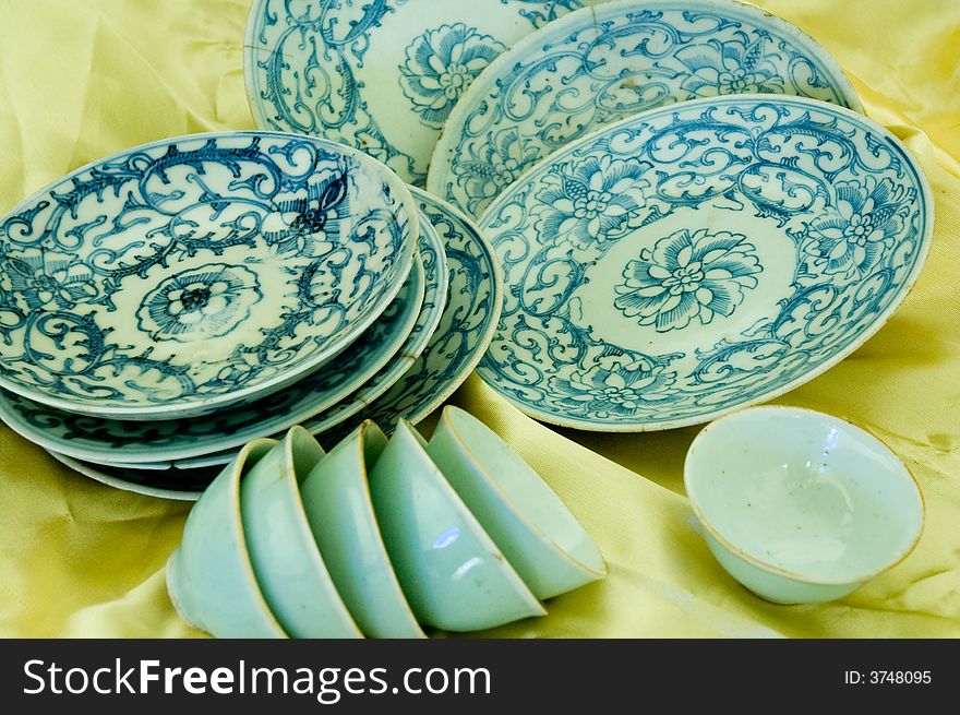 Some Chinese Qing Hua Porcelain were　display on a  yellow background. Some Chinese Qing Hua Porcelain were　display on a  yellow background