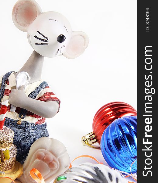Toy mouse beside Christmas Ornaments. Toy mouse beside Christmas Ornaments