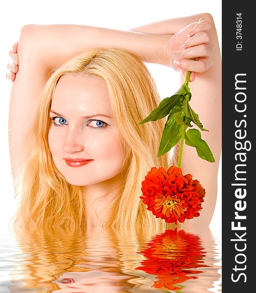 Lovely blond with flower in water over white