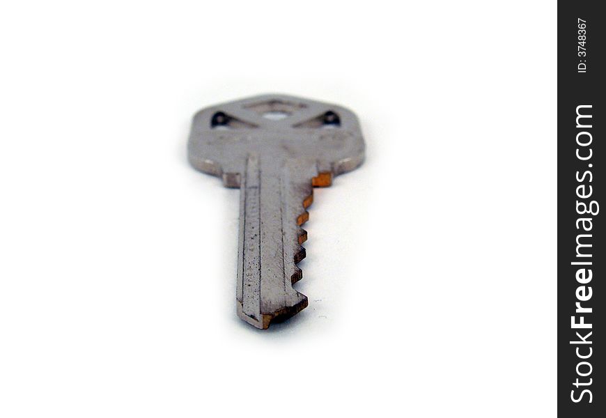 One key all alone on a white background.