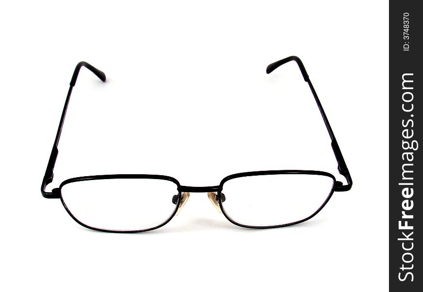 A man's reading glasses. Black metal frame and clear colorless glass.