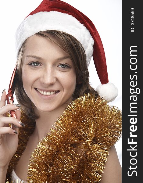 Girl in santa's hat with mobile phone. Girl in santa's hat with mobile phone