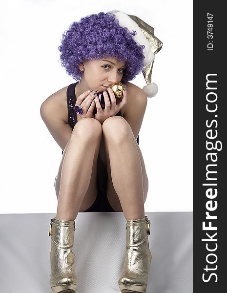 Girl in santa's hat and purple wig. Girl in santa's hat and purple wig