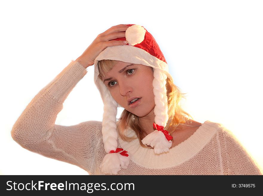 Young woman in cap of Santa thinking about New Year