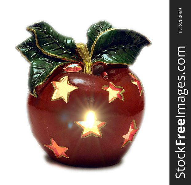 Christmas decoration - apple with burning candle inside. Christmas decoration - apple with burning candle inside