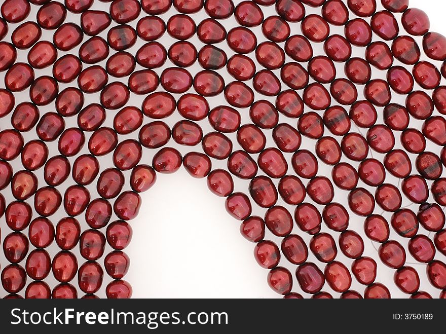 Closeup of dark red pearl strands