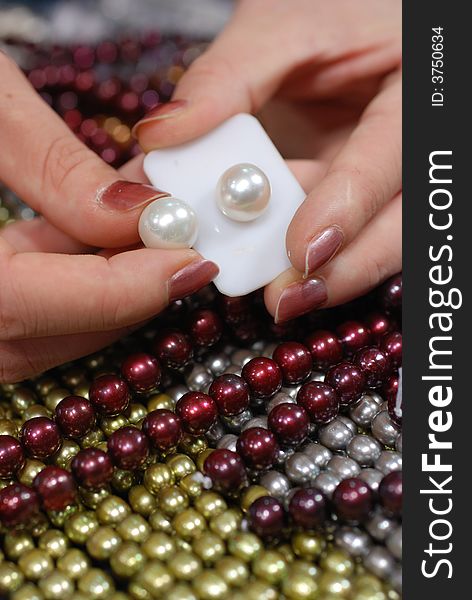 Hands holding freshwater pearls. Hands holding freshwater pearls.