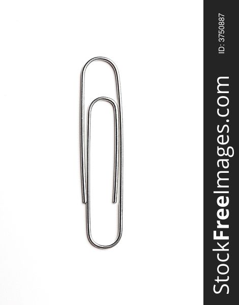 Metal paper clip isolated on white background