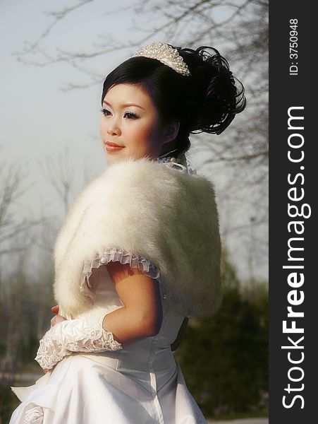 A chinese girl in white wedding dress. A chinese girl in white wedding dress