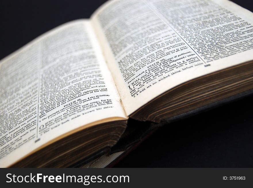 Closeup of old looking book on dark background. Closeup of old looking book on dark background