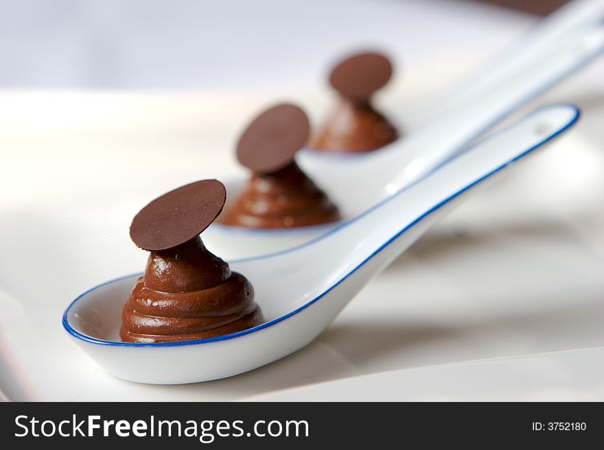 An image of fresh spoonfuls of chocolate mousse