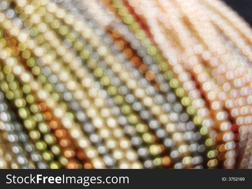 Blurred colorful freshwater pearl strands. Blurred colorful freshwater pearl strands