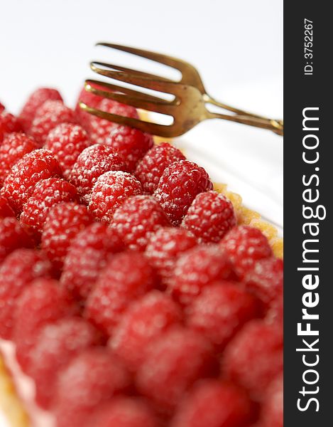 Raspberry tart with a fork