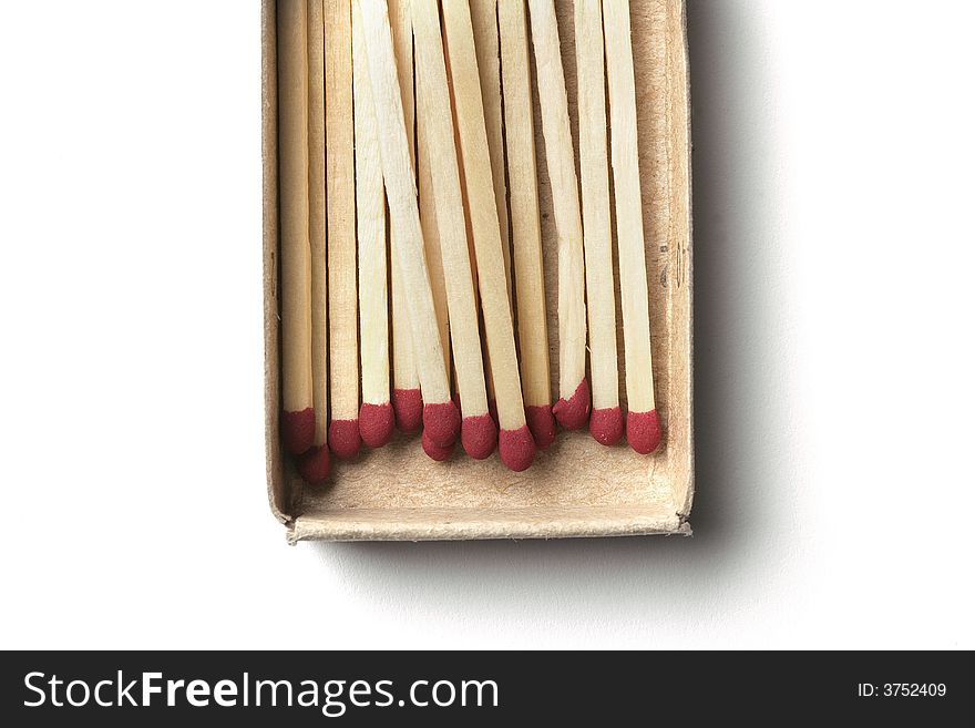 Matchsticks in matchbox cropped  isolated on white background