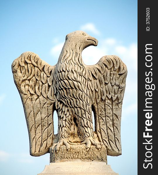 Eagle sculptured in stone on a gate