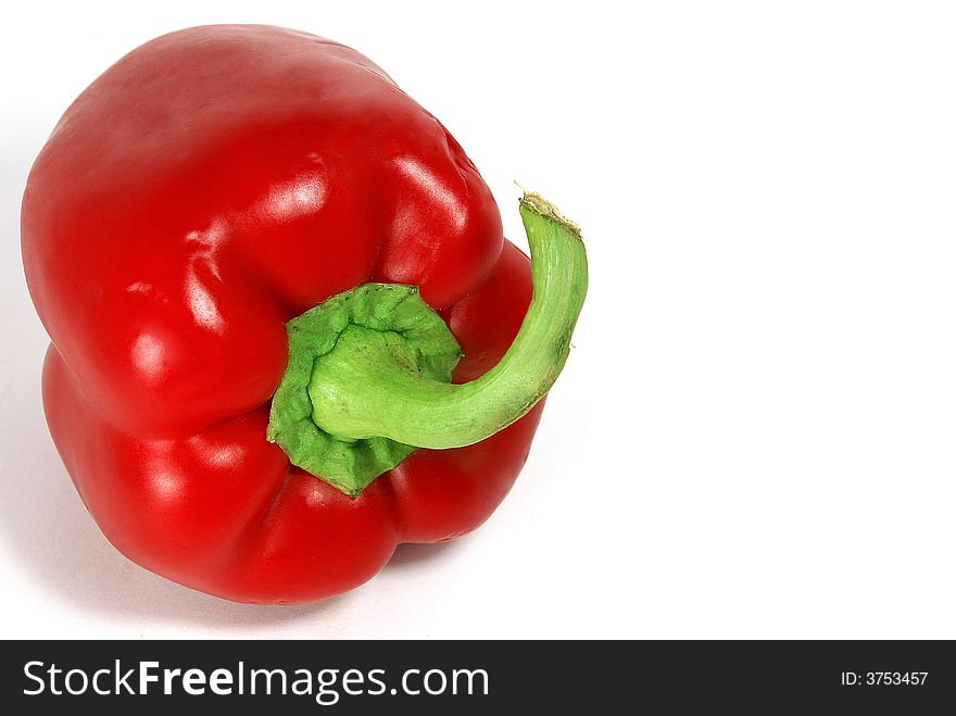 Isolated big nice green paprika with green tail against white. Isolated big nice green paprika with green tail against white