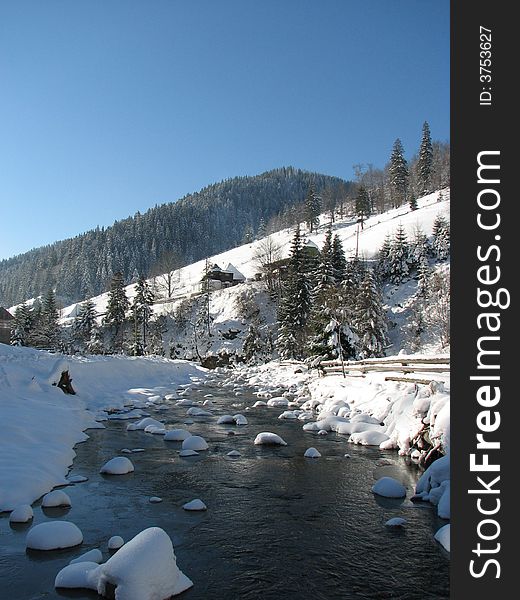 Transcarpathian winter landscape, with camper and stream. Transcarpathian winter landscape, with camper and stream