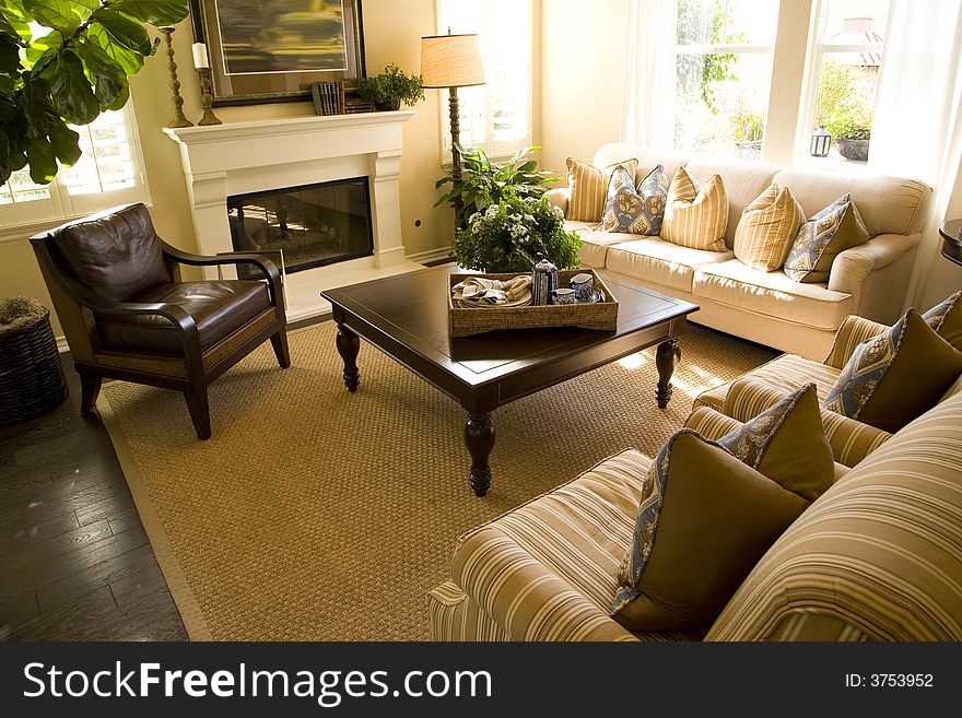 Living room with a fireplace and stylish decor. Living room with a fireplace and stylish decor.