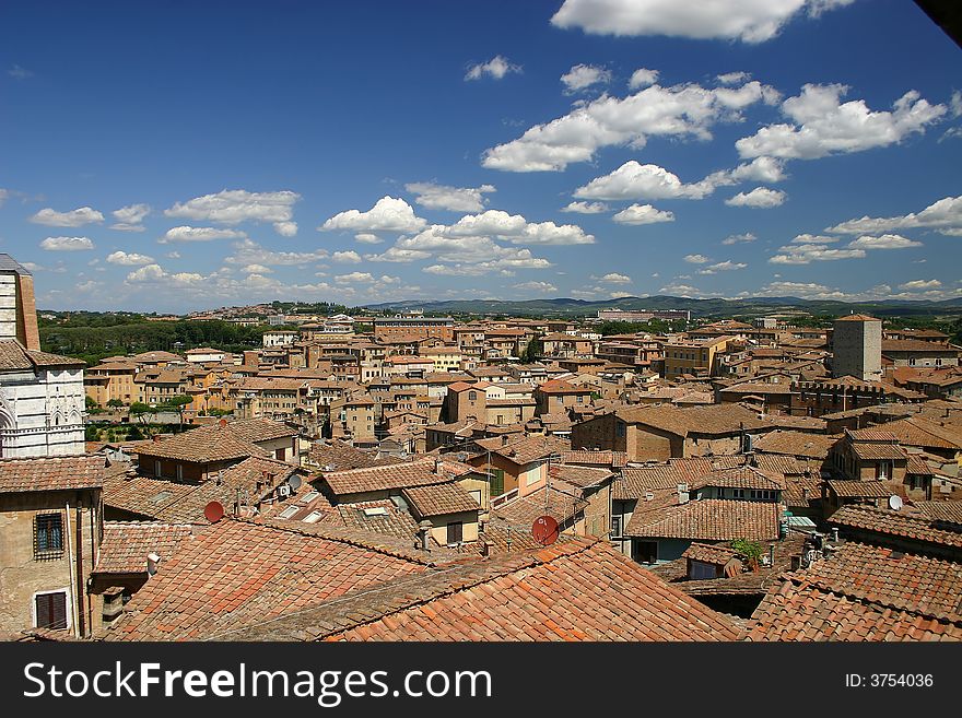 Siena, Italy rooftops and beautiful sky