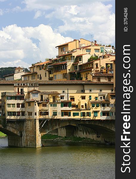 View of Ponte Vecchio, very famous landmark, in Florence, Italy from an angle not usually photographed, showing surrounding architecture. View of Ponte Vecchio, very famous landmark, in Florence, Italy from an angle not usually photographed, showing surrounding architecture