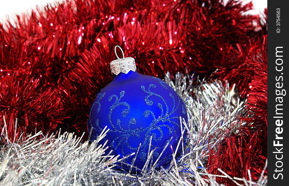 Blue christmas ball and silver tinsel