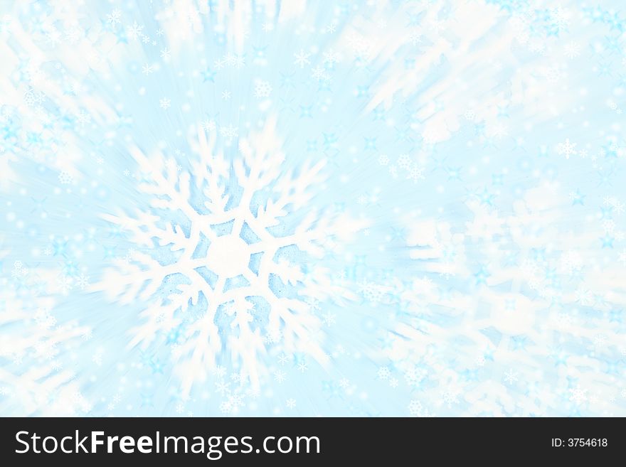 High-key, whimsical photo of snowflakes against an icy background with motion blur for a flurry effect. High-key, whimsical photo of snowflakes against an icy background with motion blur for a flurry effect.