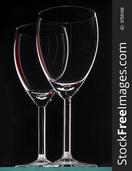 Two glasses on the black background