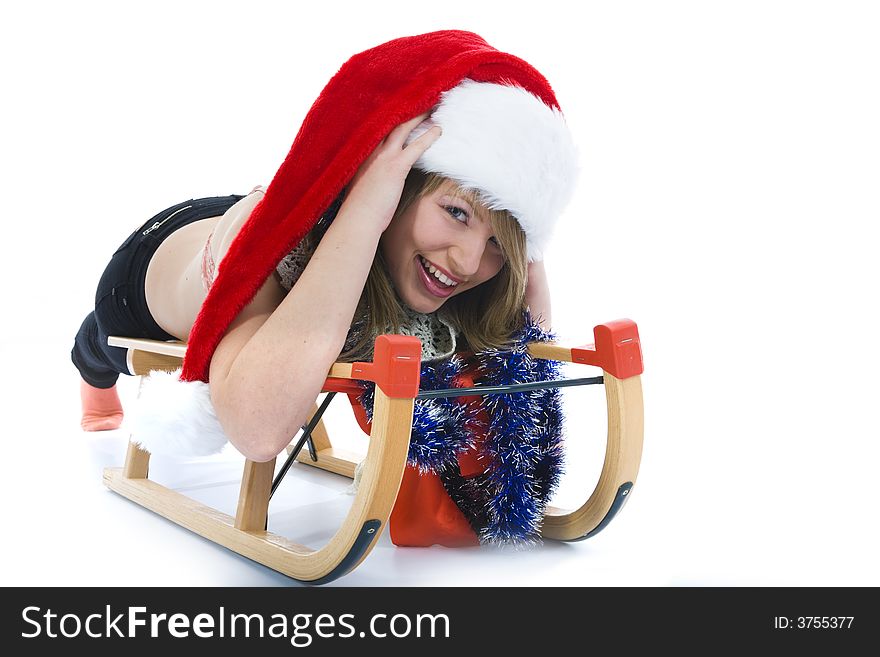 Beautiful  young woman on sledge on isolated background