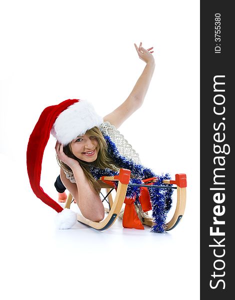 Beautiful  young woman on sledge on isolated background