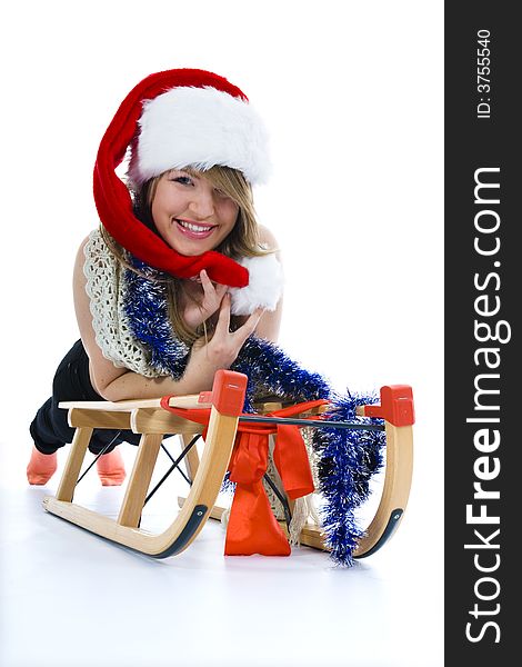 Beautiful young woman on sledge on isolated background. Beautiful young woman on sledge on isolated background