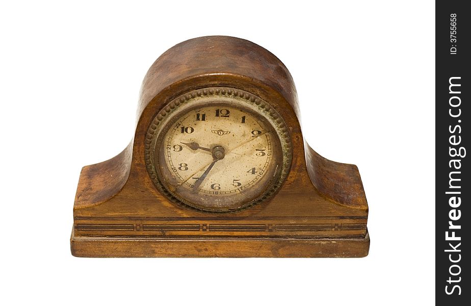 An antique wooden clock on a white background. An antique wooden clock on a white background.