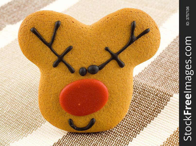 Christmas gingerbread, reindeer cookie, dessert on tablecloth. Christmas gingerbread, reindeer cookie, dessert on tablecloth