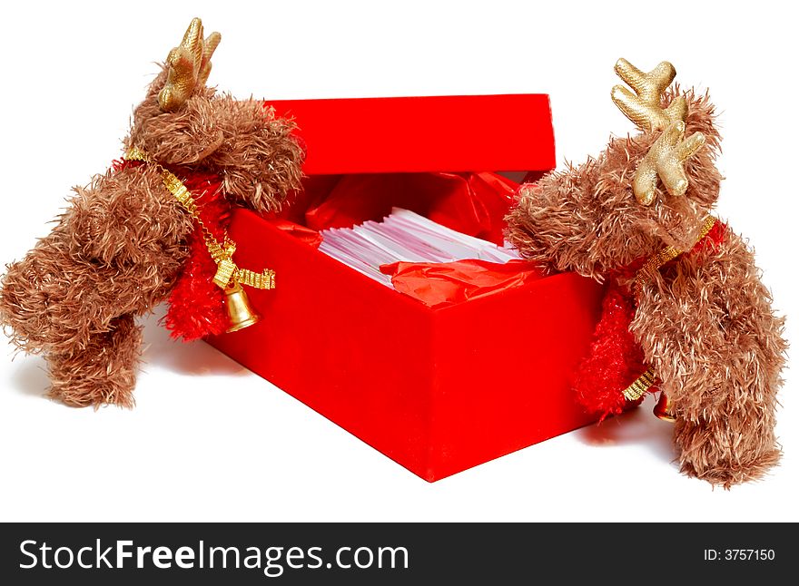 Two mousse leaning over the red gift box on Christmas on white background. Two mousse leaning over the red gift box on Christmas on white background