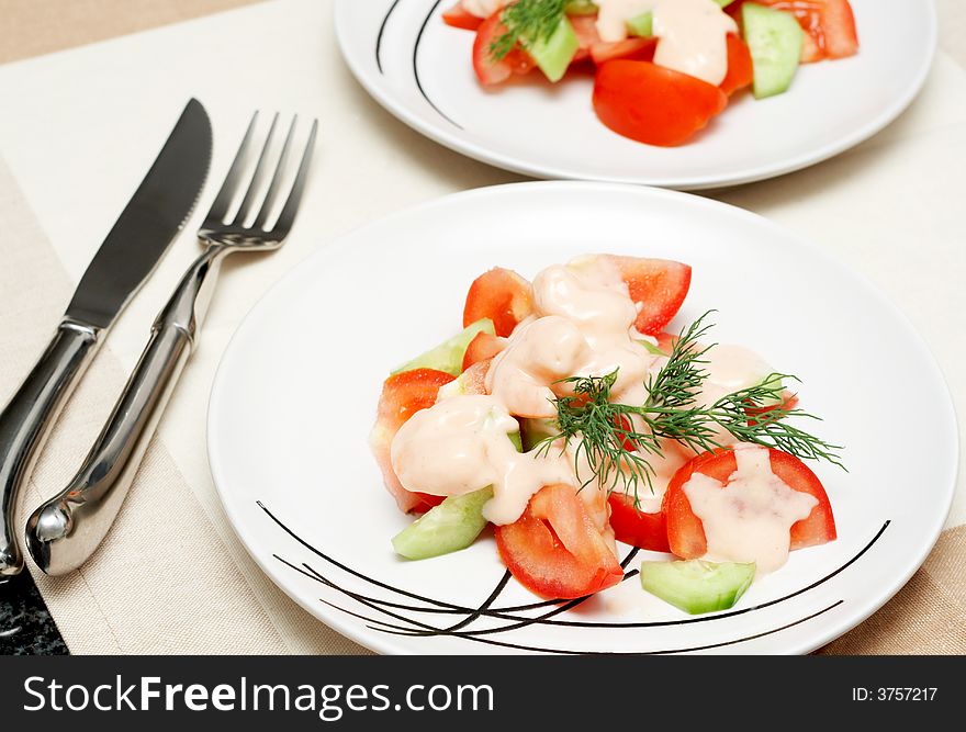 Colorful shrimp salad with tomatoes, cucumber and some dill for garnish with bell peppers in the background. Colorful shrimp salad with tomatoes, cucumber and some dill for garnish with bell peppers in the background