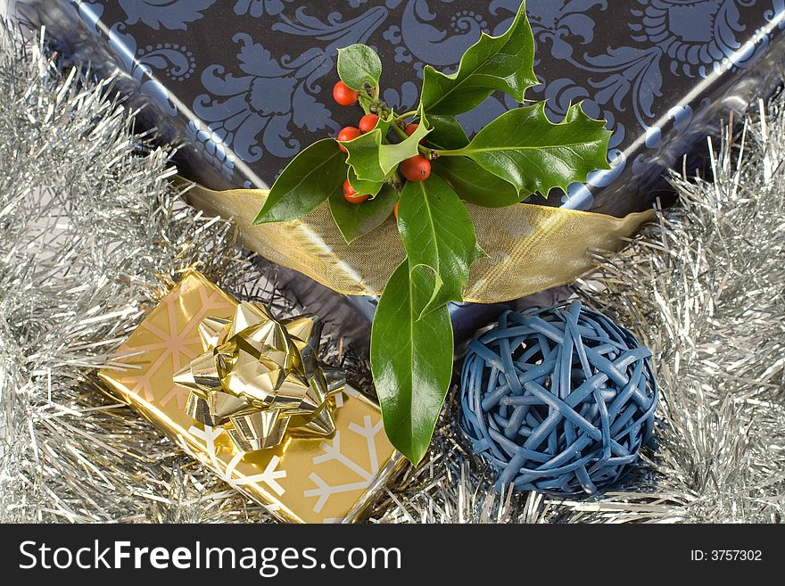 Christmas gifts, presents, wrapped with decorative stars and ribbons composition
ilex,holly on top of it. Christmas gifts, presents, wrapped with decorative stars and ribbons composition
ilex,holly on top of it