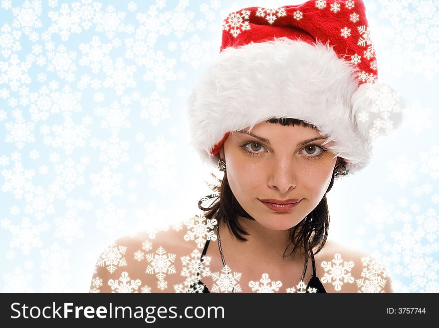 Beauty girl in santa red cap on white