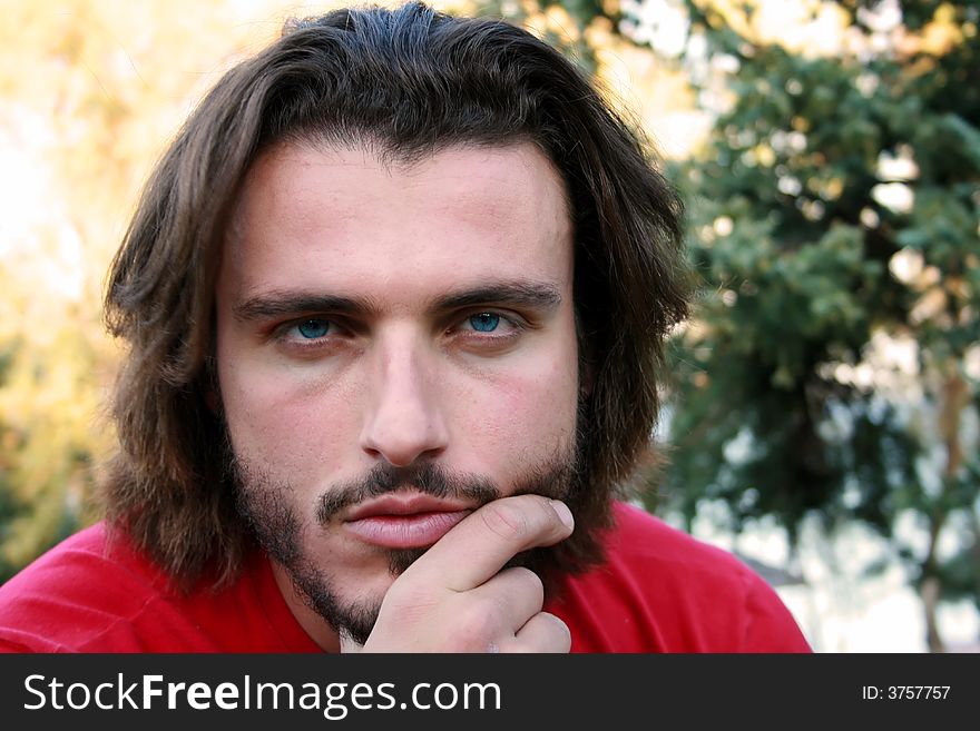 A handsome blonde young man portrait looking at the camera