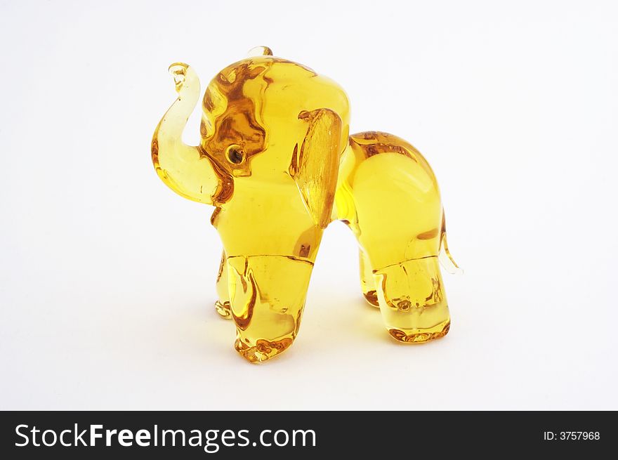 Figurine of yellow glass elephant.