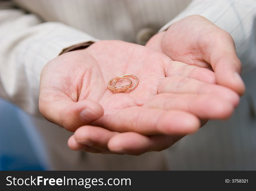 Golden rings on the palm