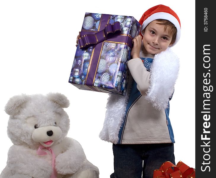 A celebratory card.
The boy in a cap santa with gifts and a bear on a white background. Isolated. Studio. A celebratory card.
The boy in a cap santa with gifts and a bear on a white background. Isolated. Studio.