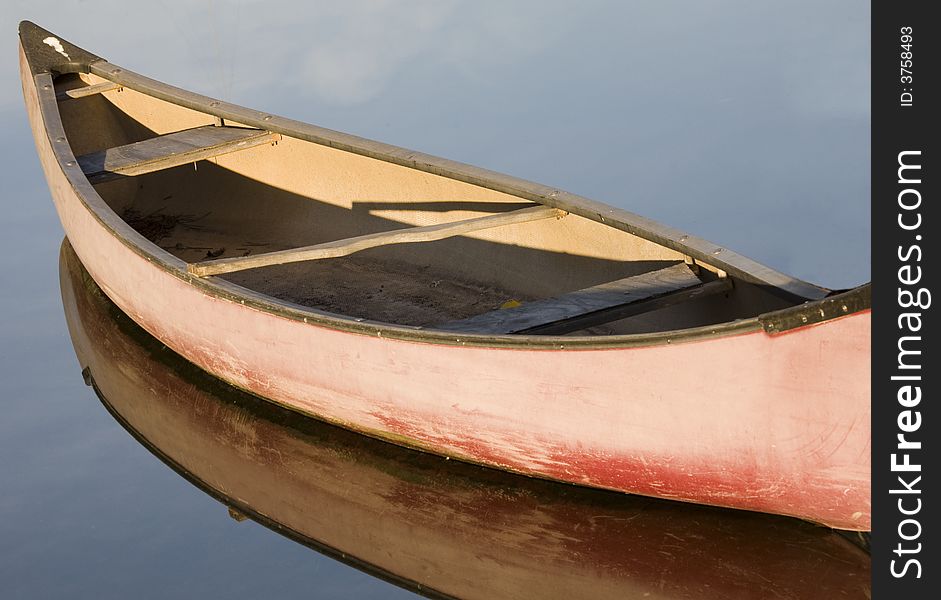 Pink canoe moored on Venice Canals, California