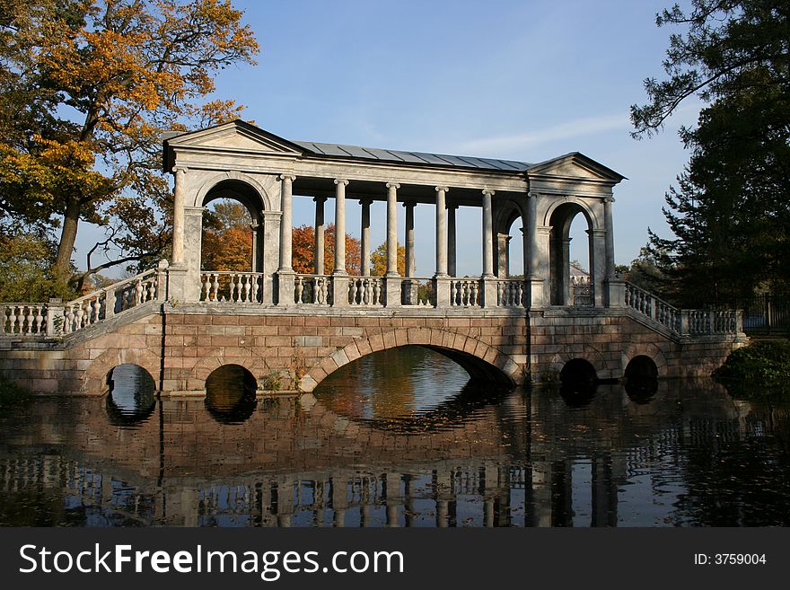 Bridge in style of classicism in an autumn park. Bridge in style of classicism in an autumn park