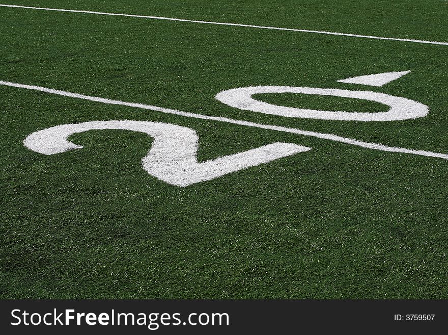 20 yard line in vivid detail at a football stadium. 20 yard line in vivid detail at a football stadium.