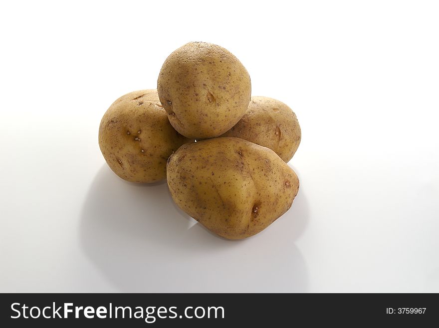 Potatos isolated against a white background. Potatos isolated against a white background.
