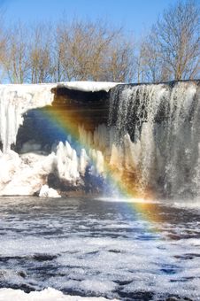Rainbow Over Iced Waterfall Stock Photos