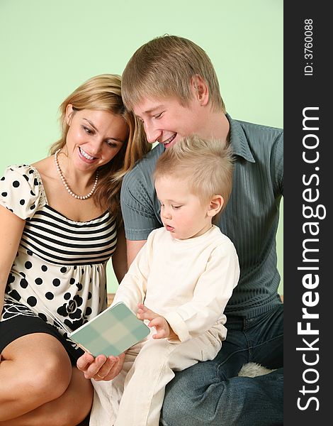 Child With Book And Parents