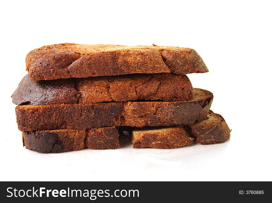 Pile of rye bread pieces over white