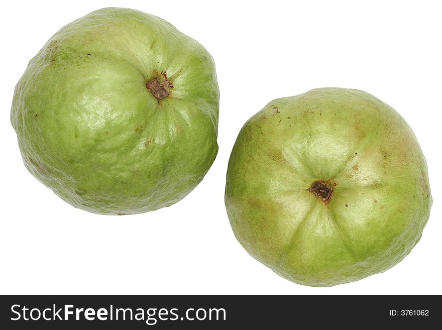 Two large, green stone seed guavas over white
