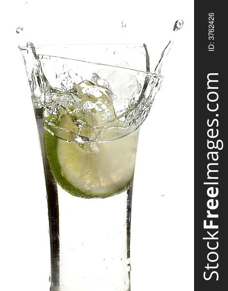 Glass with juice and lemon on the white background