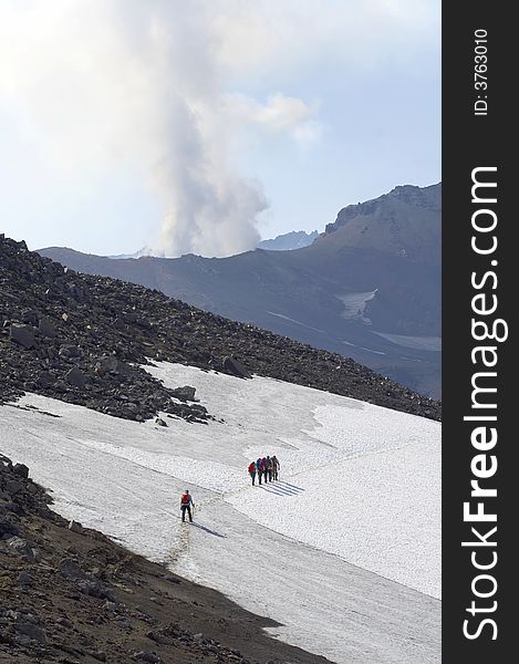 Tourists near volcano.  Kamchatka. Russia. Tourists near volcano.  Kamchatka. Russia.